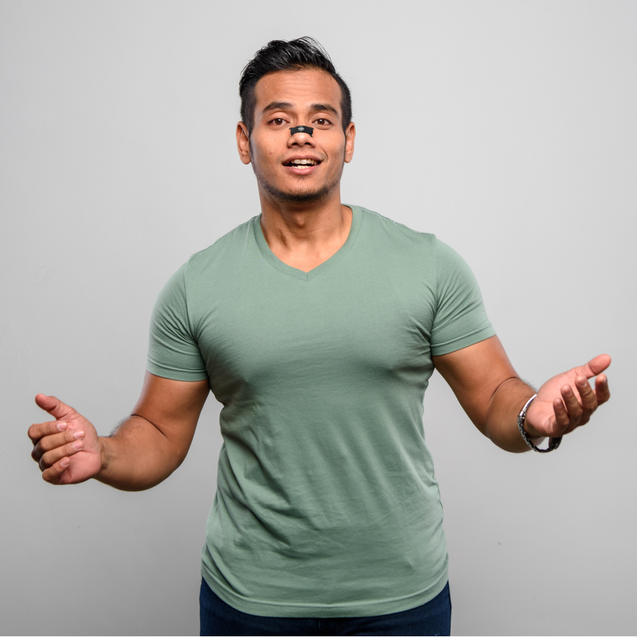 Man wearing a green t-shirt against a gray background why nose breathing